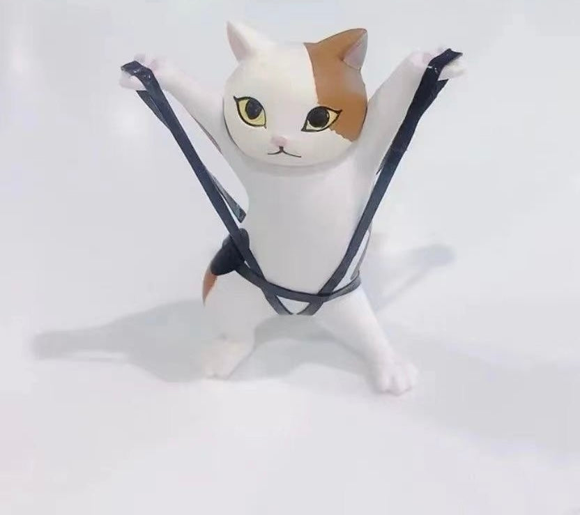 踊る猫の置物